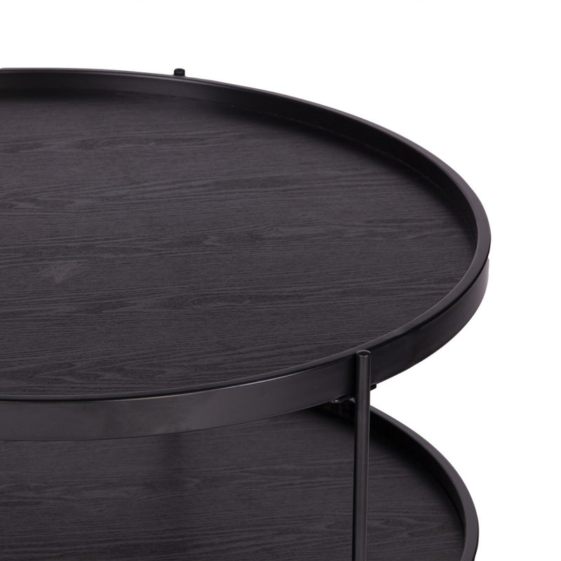 Two-tier round coffee table close-up, dark wood grain surfaces with black metal edge