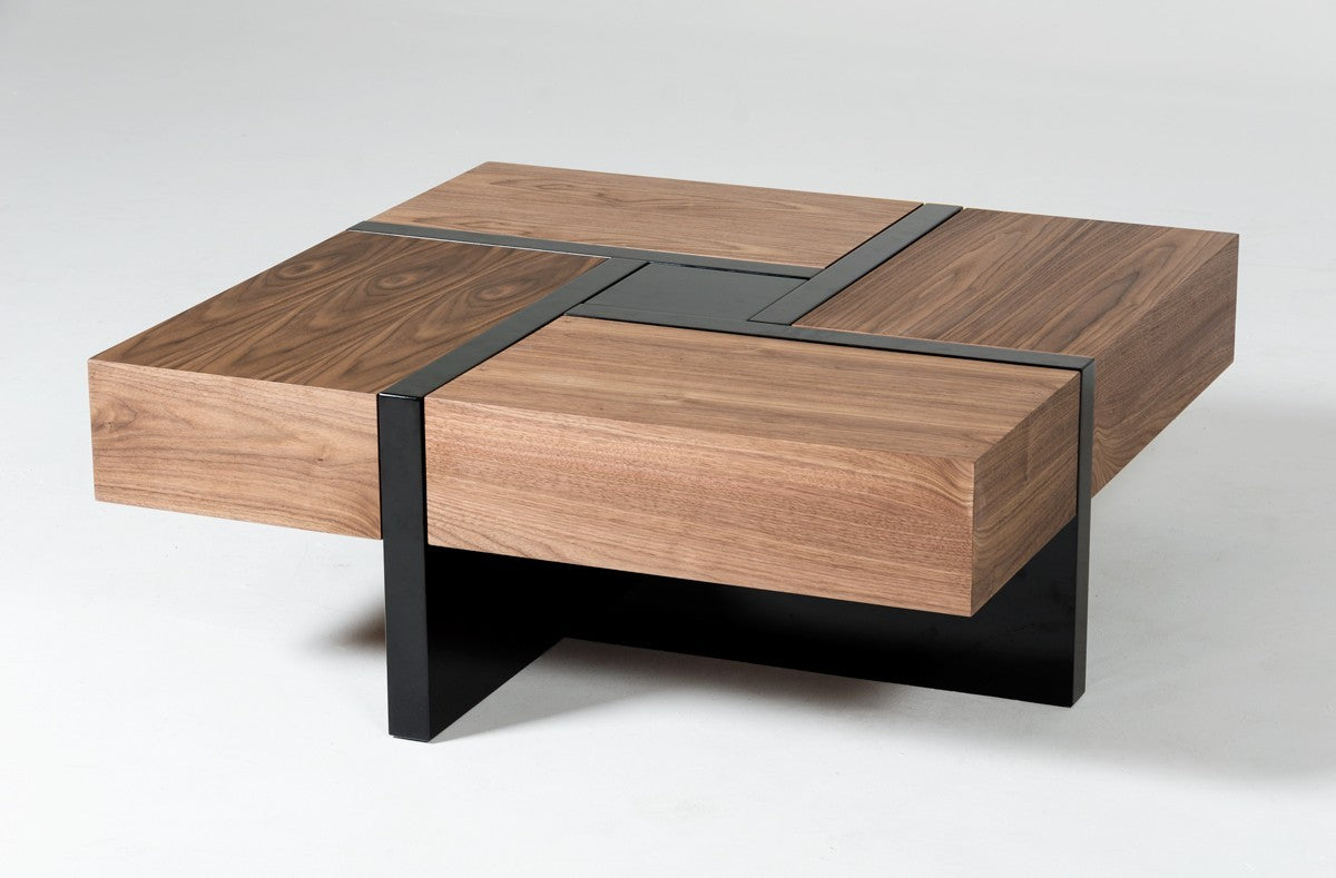Wood coffee table with black base and four drawers, dark top insert