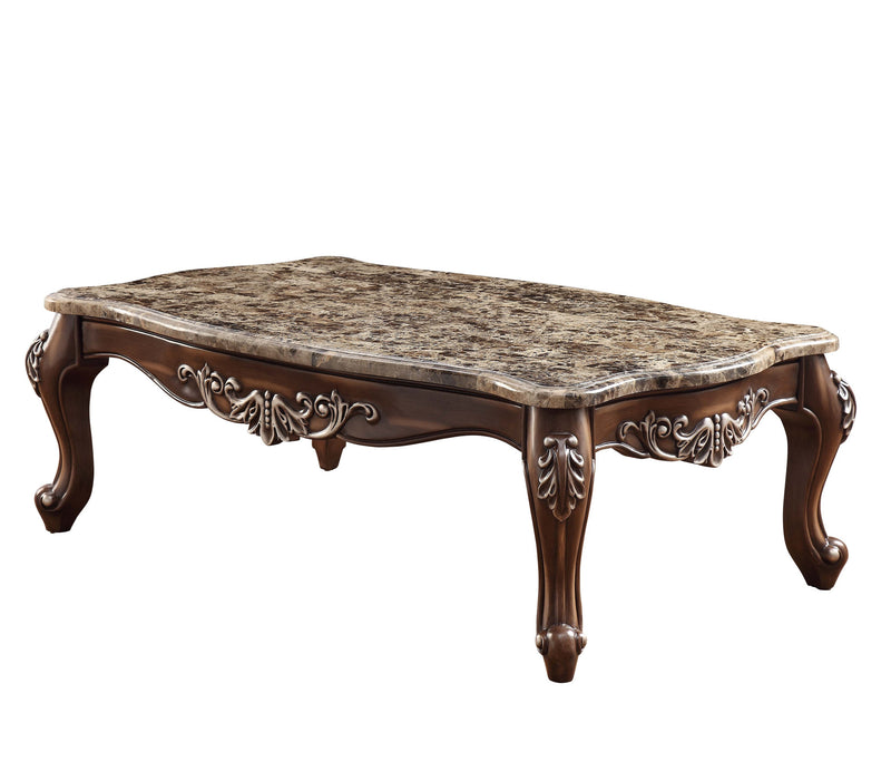 Faux marble top brown coffee table with decorative carved apron and four feet