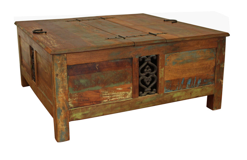 Brown square lift-top trunk coffee table with carved door panel and metal latch
