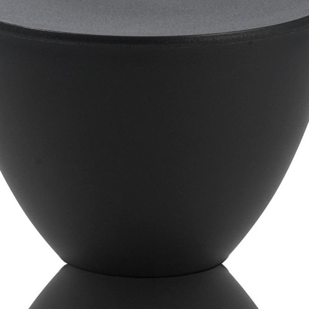 Matte black hourglass side table body with smooth curved sides and rounded base.