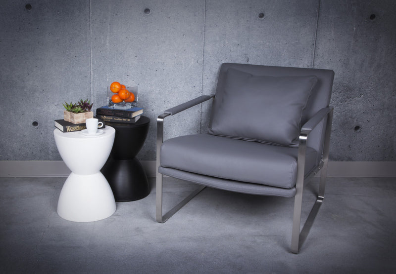 Black hourglass outdoor side table with round top and tapered pedestal base.