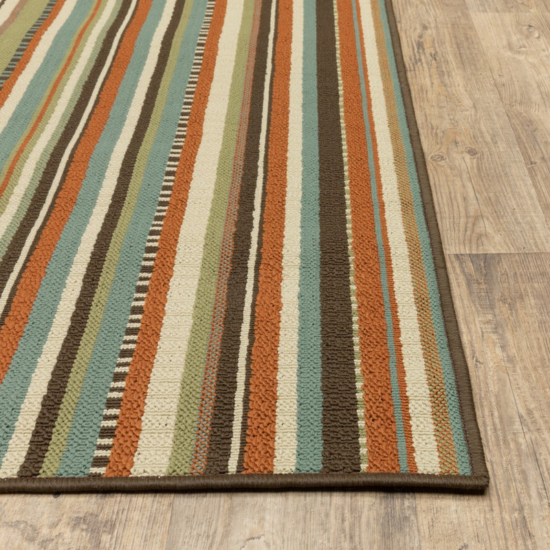 Multicolor striped indoor/outdoor area rug, angled view of full corner