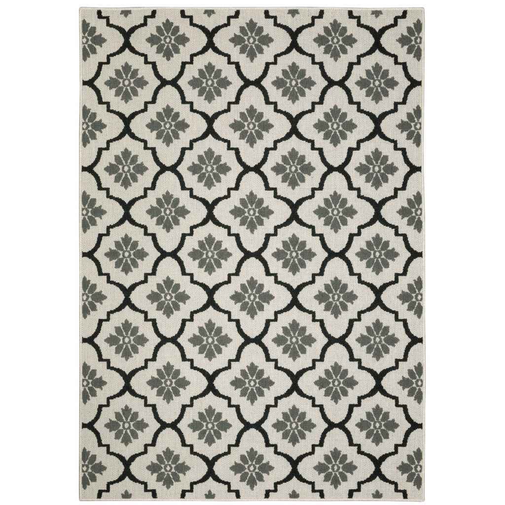 7' X 9' Beige and Black Geometric Stain Resistant Indoor Outdoor Area Rug