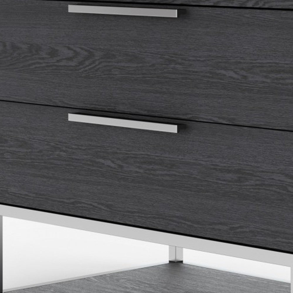Gray nightstand drawer fronts with silver bar handles and visible wood grain.