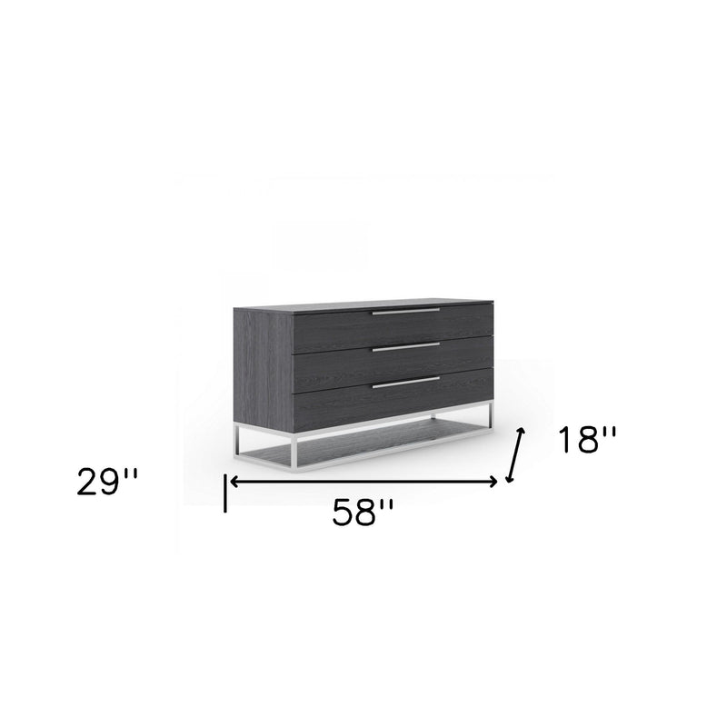Grey three-drawer dresser, 58 in wide, metal bar pulls and open-frame base.