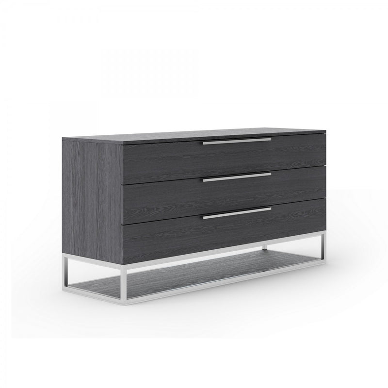 Grey three-drawer dresser with wood-grain finish and metal bar pulls.