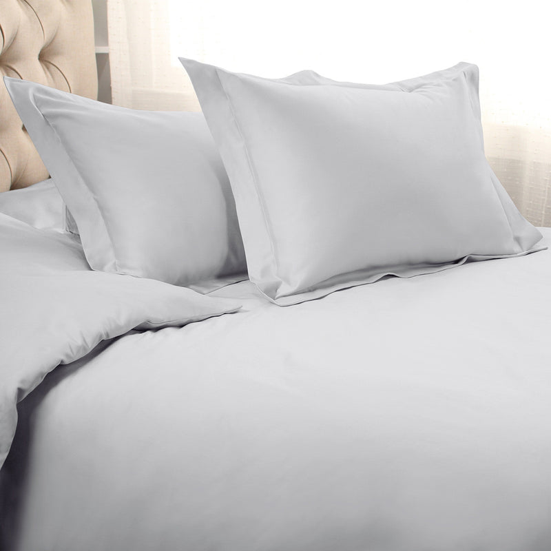 Cotton duvet cover set with two pillow shams, white, arranged on bed
