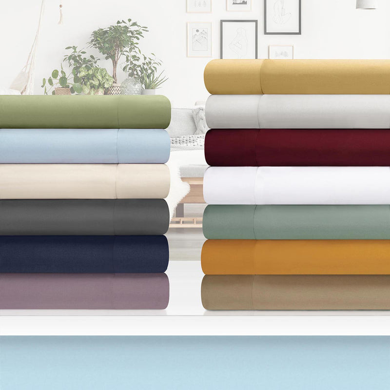 Assorted folded duvet covers in solid colors, including navy blue