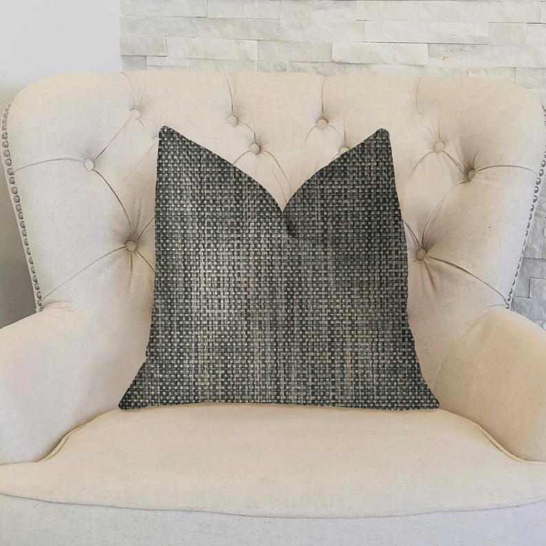 Dark gray square throw pillow with light speckled weave on tufted sofa back