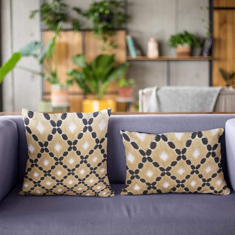 Set of two geometric velvet pillows, gold and cream with black diamond lattice pattern