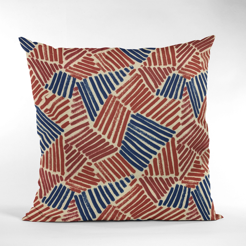Front view abstract geometric throw pillow in red, blue, and off-white