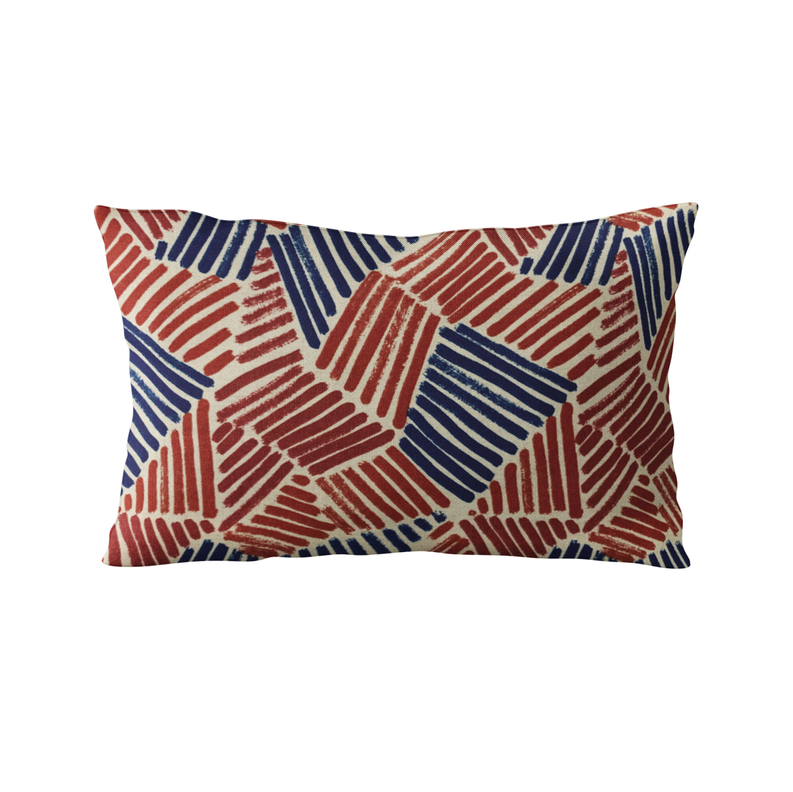 Abstract sketch throw pillow with red and blue geometric pattern on off-white cover