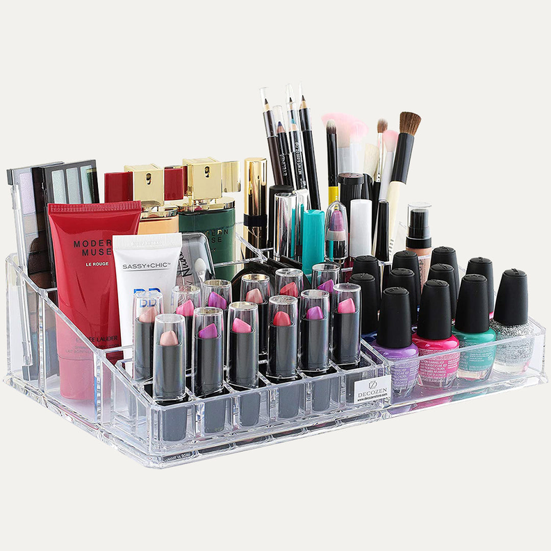 Transparent makeup organizer with 21 lipstick and beauty compartments, visible cosmetics set