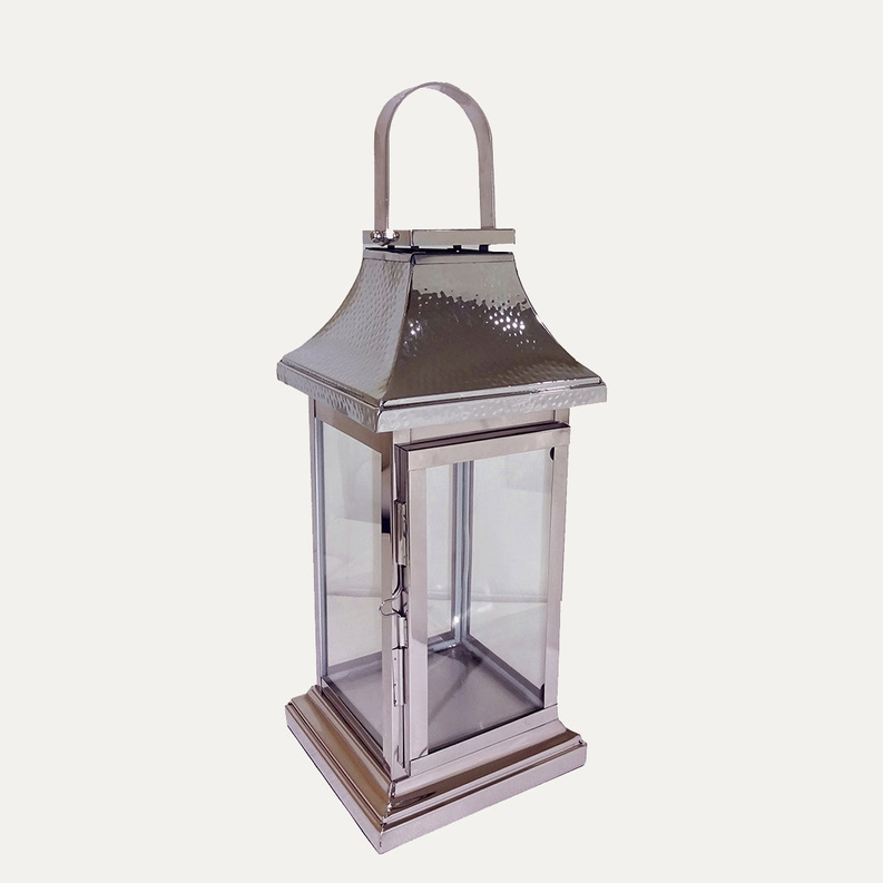 Silver metal candle lantern with glass panels and arched handle, open top