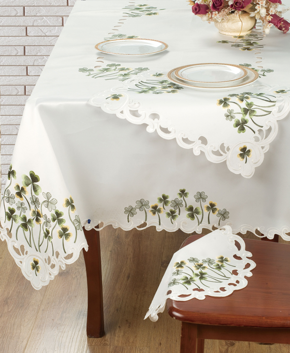 Ivory floral lace table cover with scalloped edge on dining table
