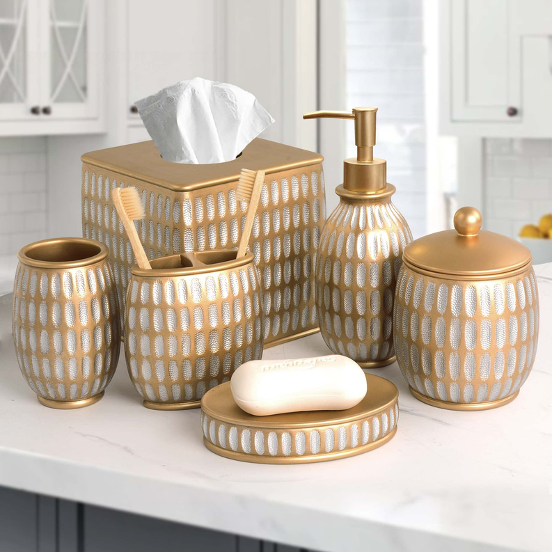 Bathroom accessory set in beige ceramic with gold tops, bar soap dish and lotion pump