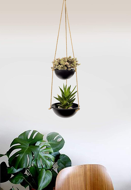Two-tier hanging planter with two black pots and rope straps, flowers and succulents