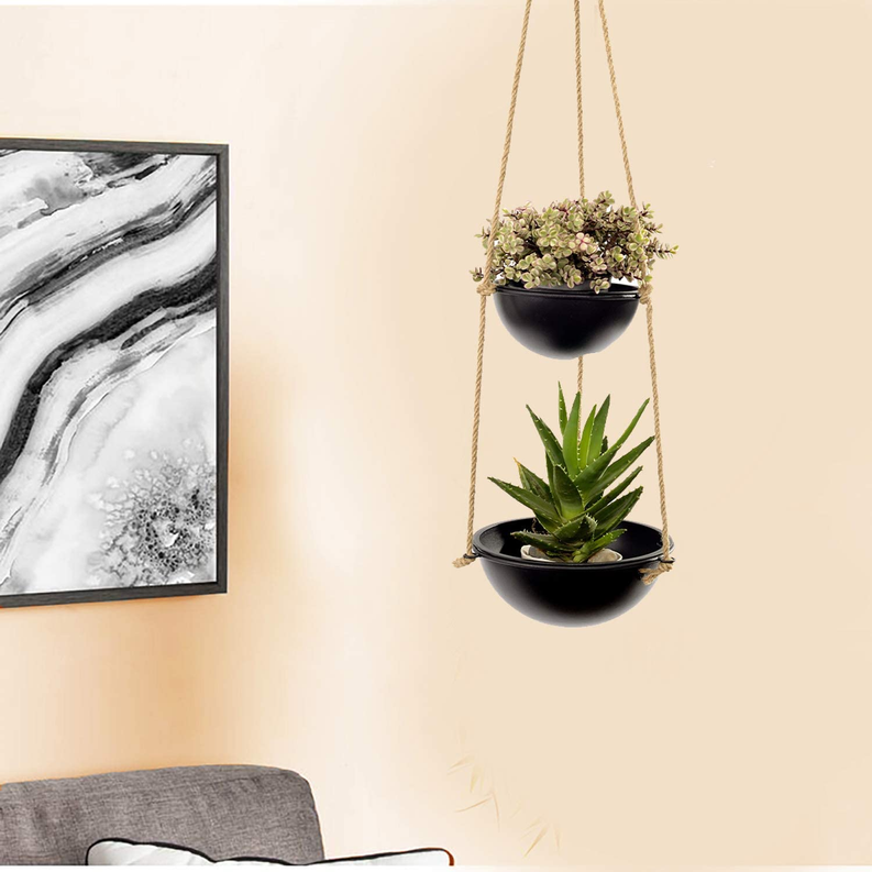 Two-tier hanging planter with two black pots on rope, featuring flowers and a green succulent