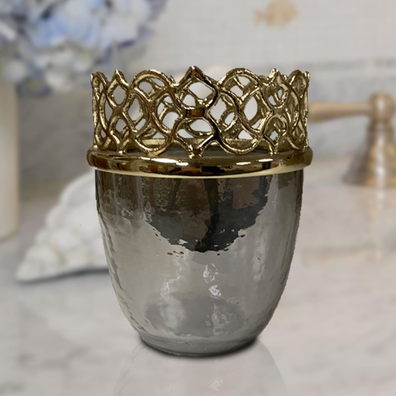 Silver-toned bathroom tumbler with ornate gold lattice rim