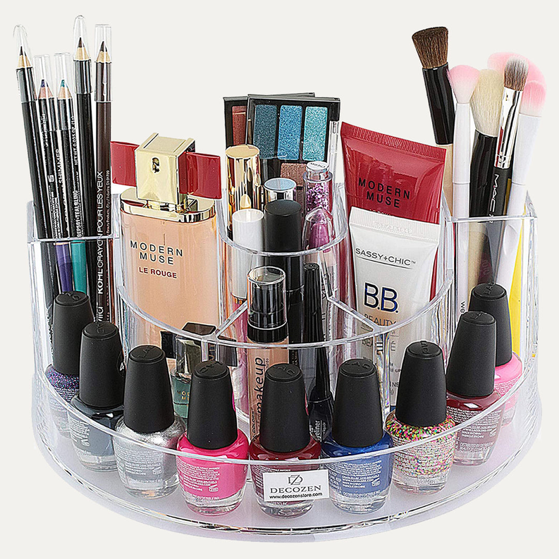 Clear acrylic makeup organizer with 7 slots filled with lip products and brushes