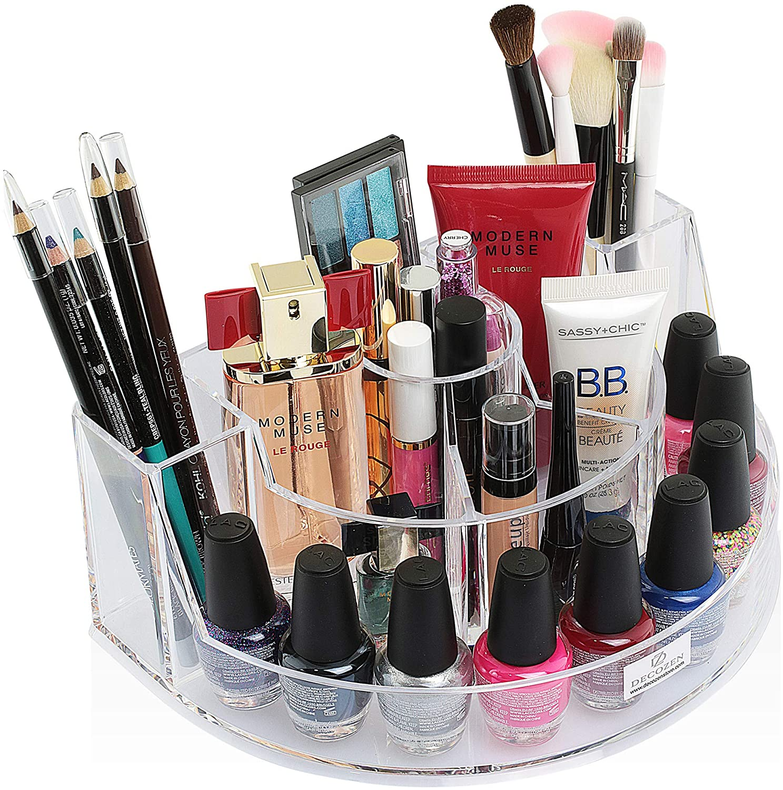 Clear makeup organizer with 7 slots holding lipsticks and makeup brushes