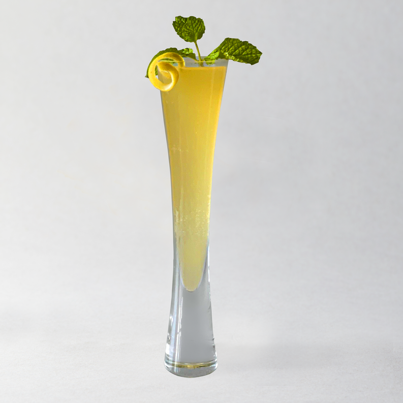 Peach chamomile mixer in tall glass with curled leaf garnish