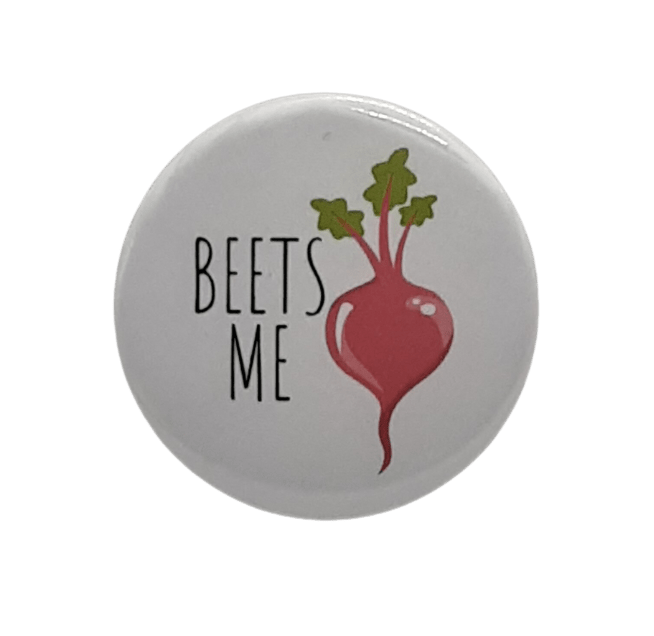 Beets Me round button with red beet illustration and green leaves on light background