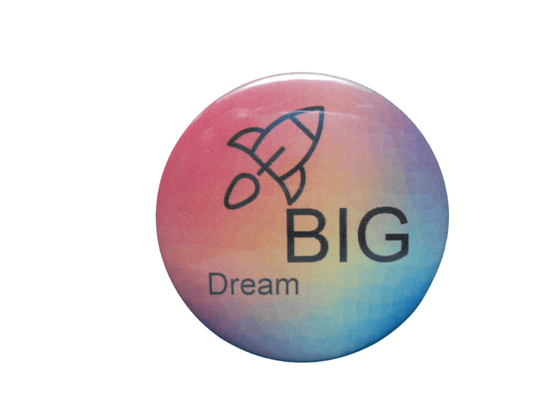 Round inspirational button badge with rocket icon and “BIG Dream” text