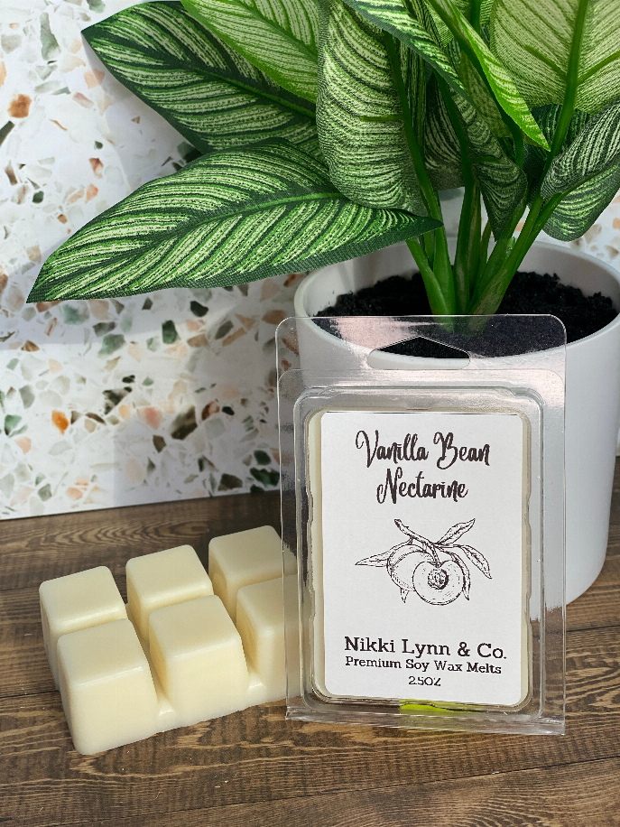 Clear clamshell of Vanilla Bean Nectarine wax melts with pale yellow cubes and label