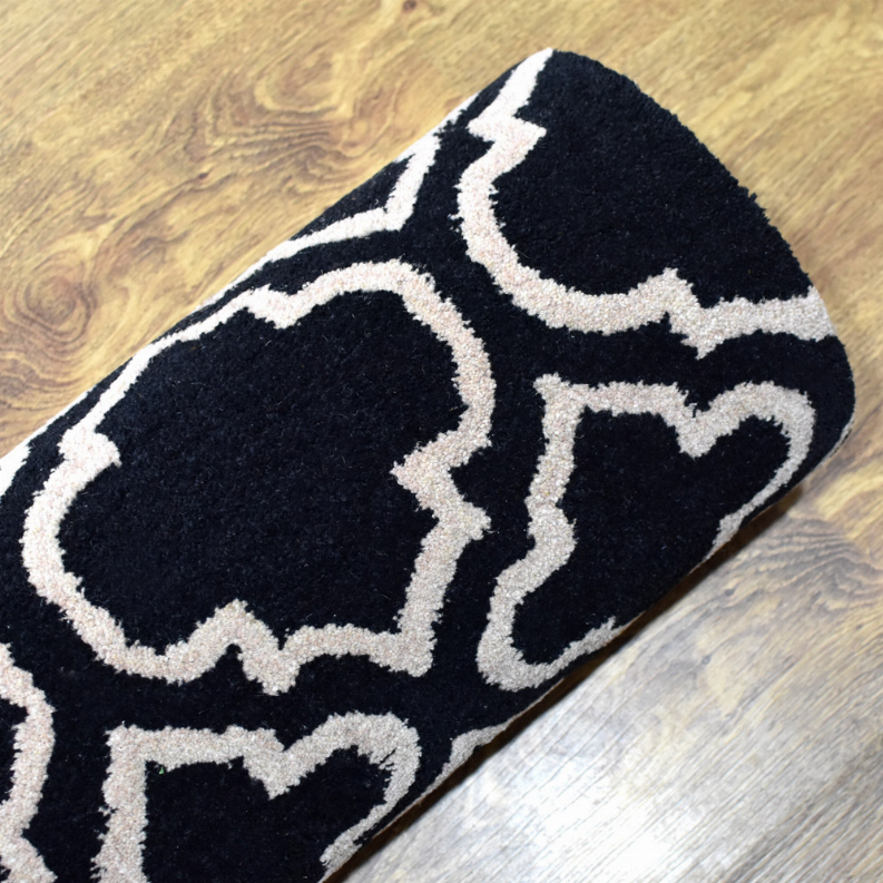 Geometric runner rug with navy background and white trellis-like diamond pattern