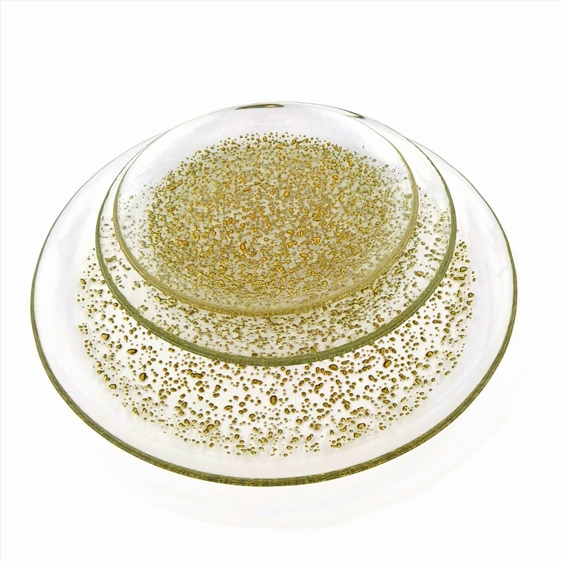 12-piece emerald green glass dinner plate with gold speckled rim and center