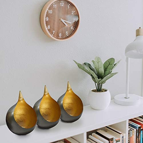 Gold-and-black teardrop tea light candle holders, three-piece on shelf