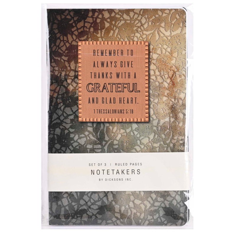 Wrapped mottled journal with copper quote plaque and 'NOTETAKERS' label at bottom.