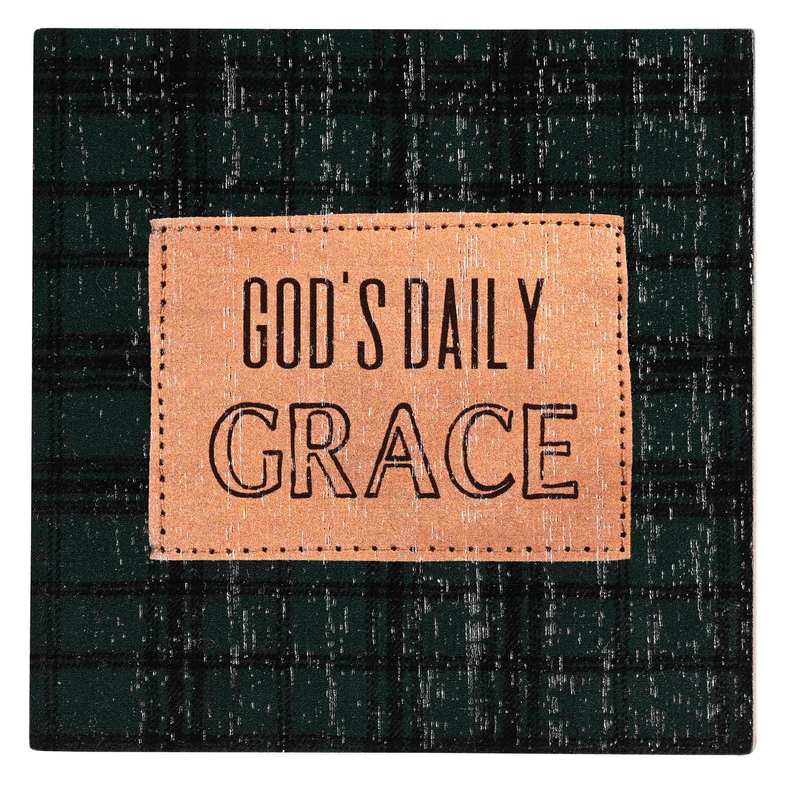 Black plaid card with tan leather-look patch reading God’s Daily Grace