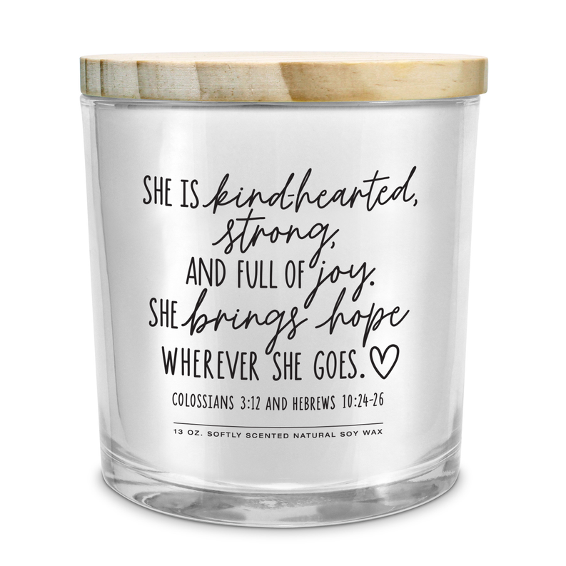 Soy candle jar with printed inspirational quote on frosted label and beige lid, 13 oz