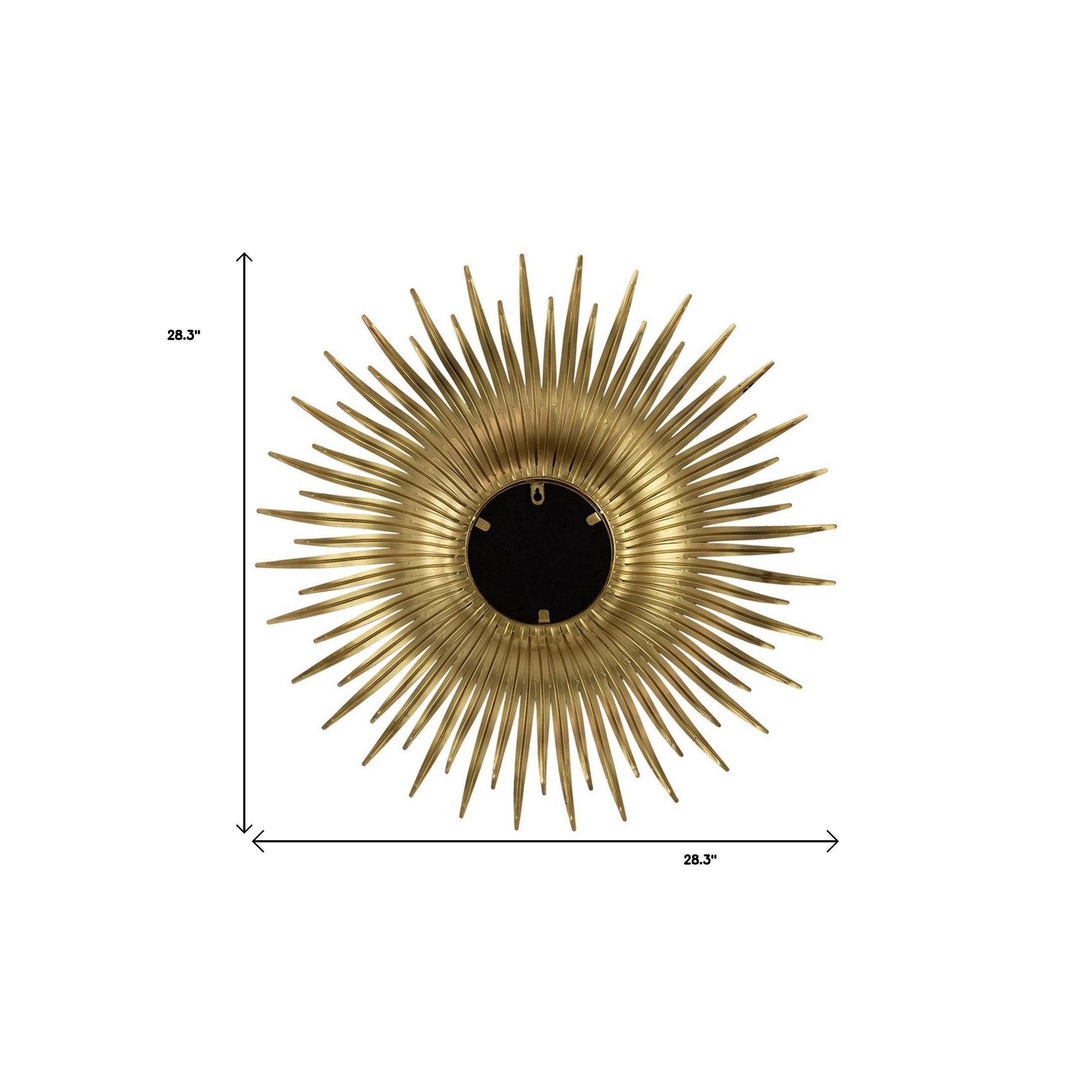 Gold sunburst accent mirror with round glass center; dimensions shown