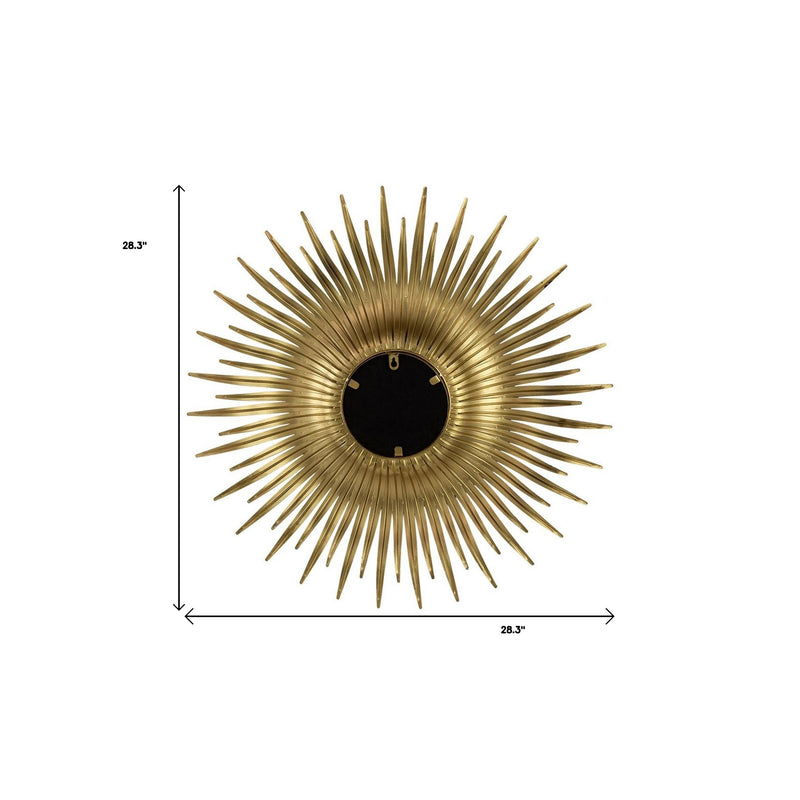 Gold sunburst accent mirror with round glass center; dimensions shown