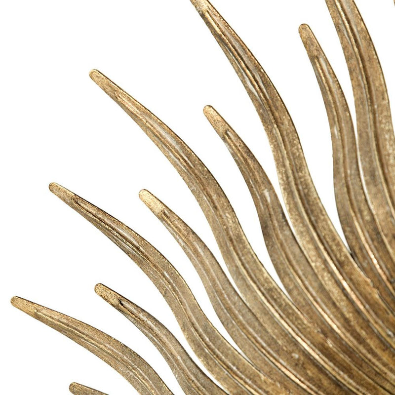 Close-up of gold iron sunburst mirror spikes with textured finish