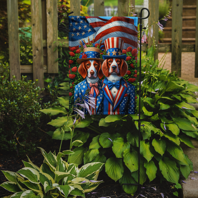 Patriotic garden flag with two dressed dogs on a stake in a garden