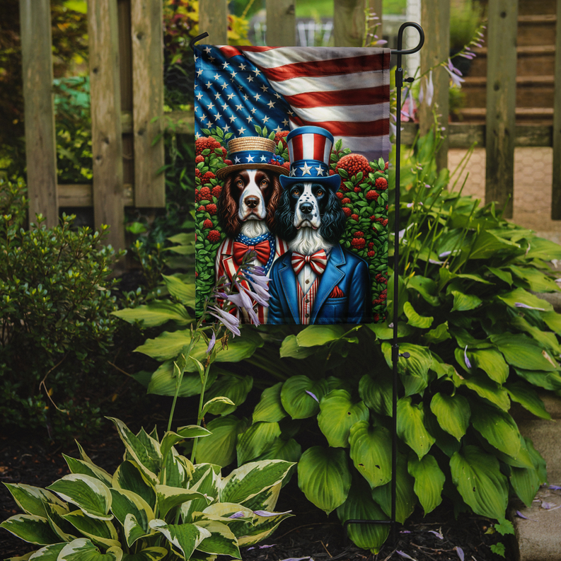 Garden flag with two Springer Spaniels in blue and red patriotic outfits beside U.S. flag