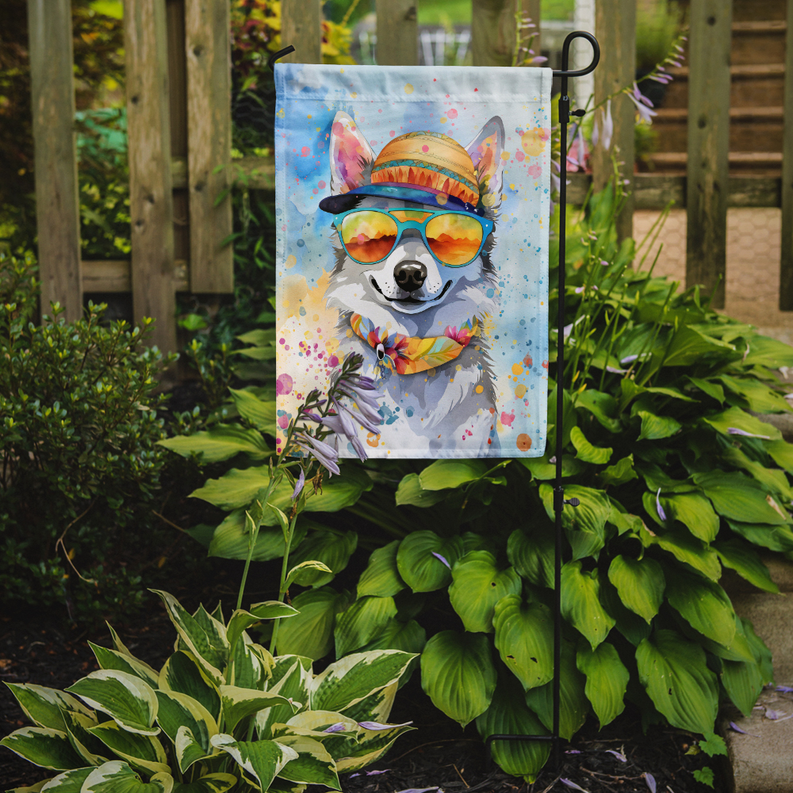 Hanging dog garden flag with hat and colorful sunglasses on a metal yard stake