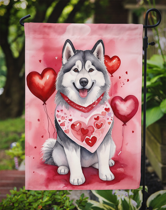 Pink Valentine garden flag featuring Alaskan Malamute with heart balloons and bandana