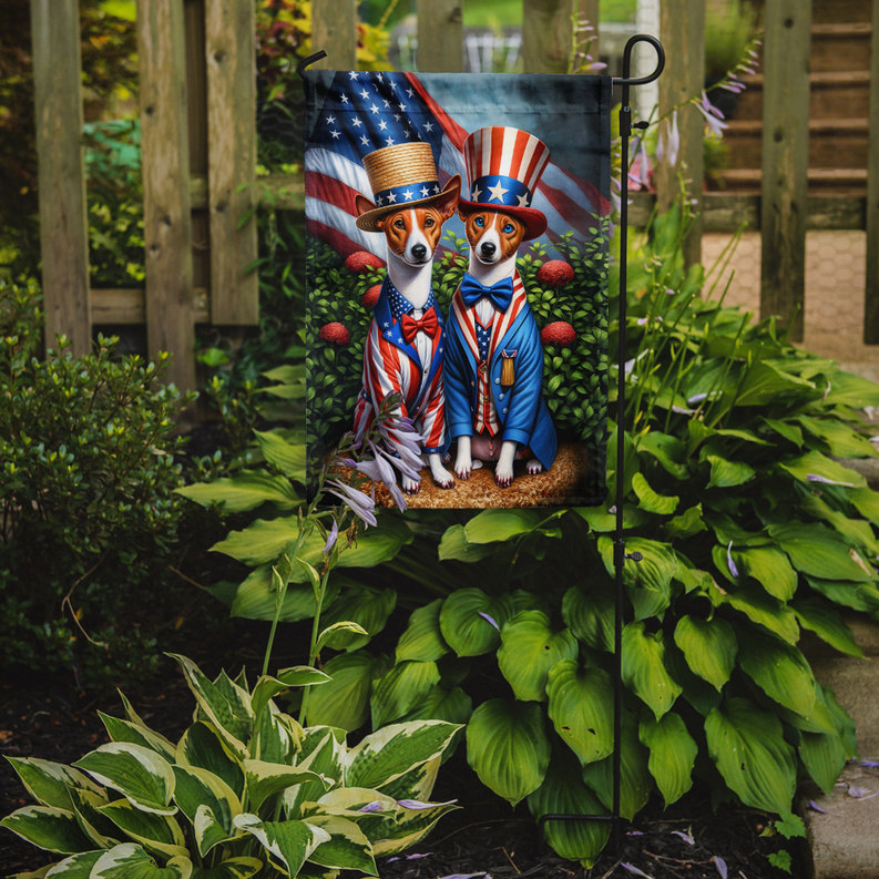 Basenji garden flag hanging on pole with two dogs in patriotic clothing