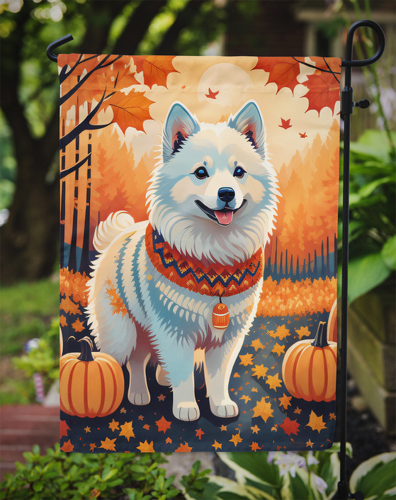 Fall garden flag close-up with husky in orange foliage, star leaves, and pumpkins