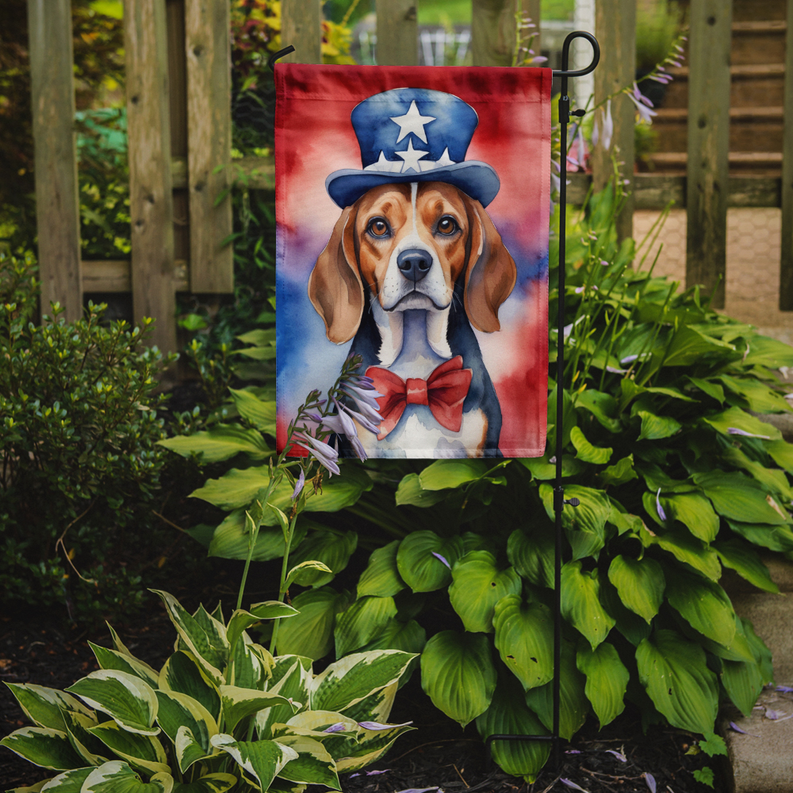 Patriotic beagle garden flag standing in a flower garden
