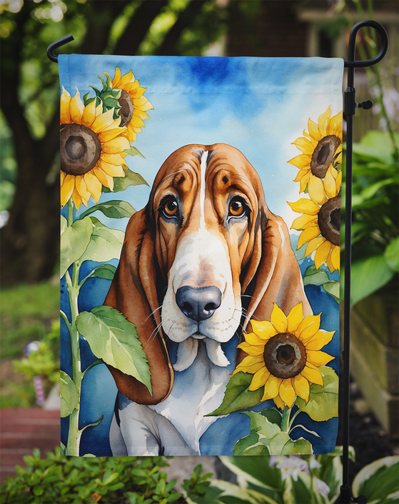 Basset hound garden flag featuring brown dog face with sunflowers and green leaves