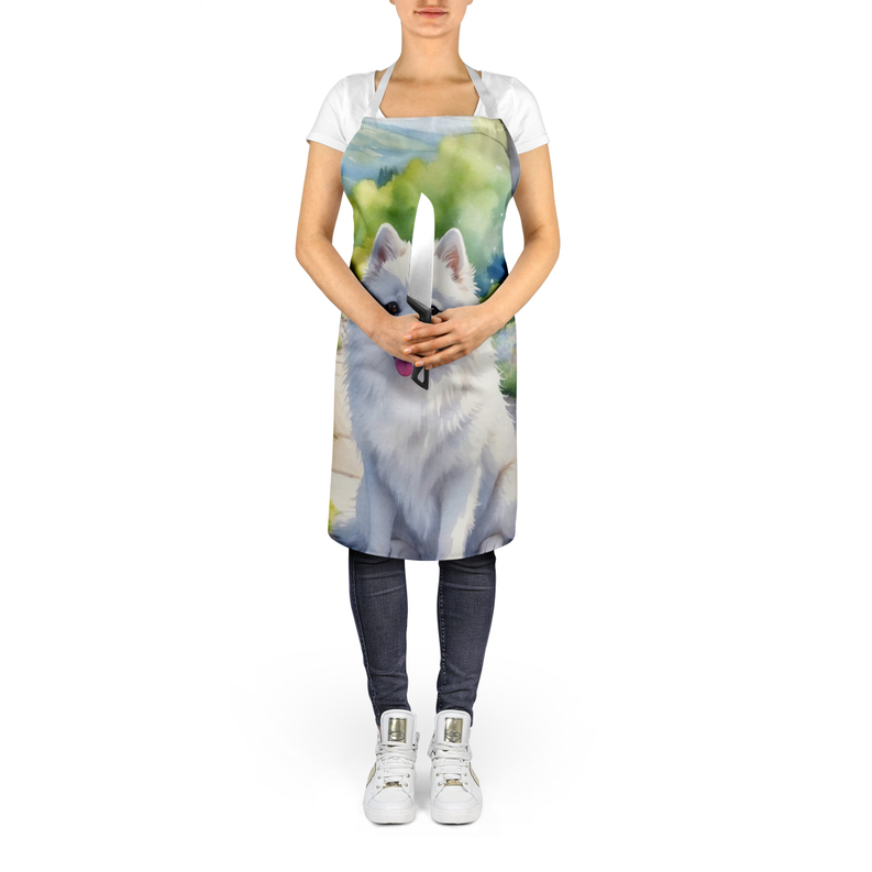 Apron worn by model: white straps, colorful watercolor dog and garden path print