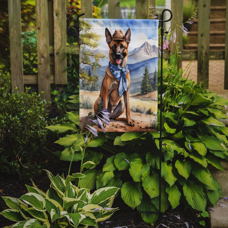 Belgian Malinois cowboy welcome garden flag on a stake in front of plants