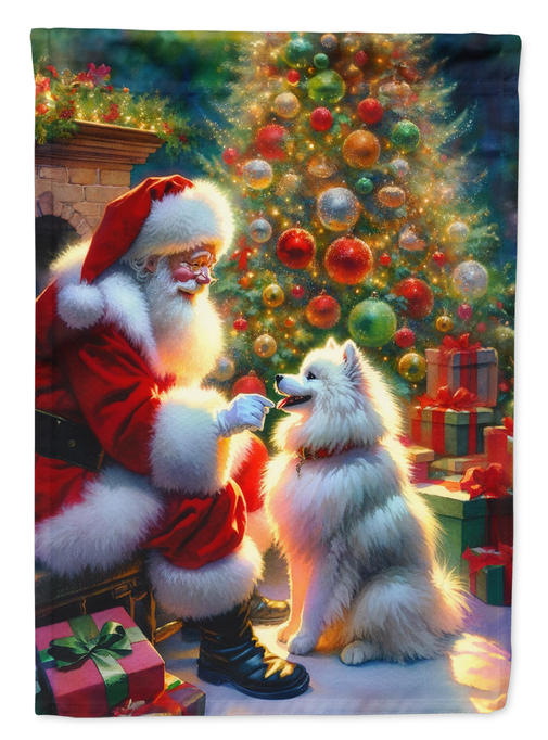 Rectangular garden flag with Santa and a white-furred child in front of an ornament tree